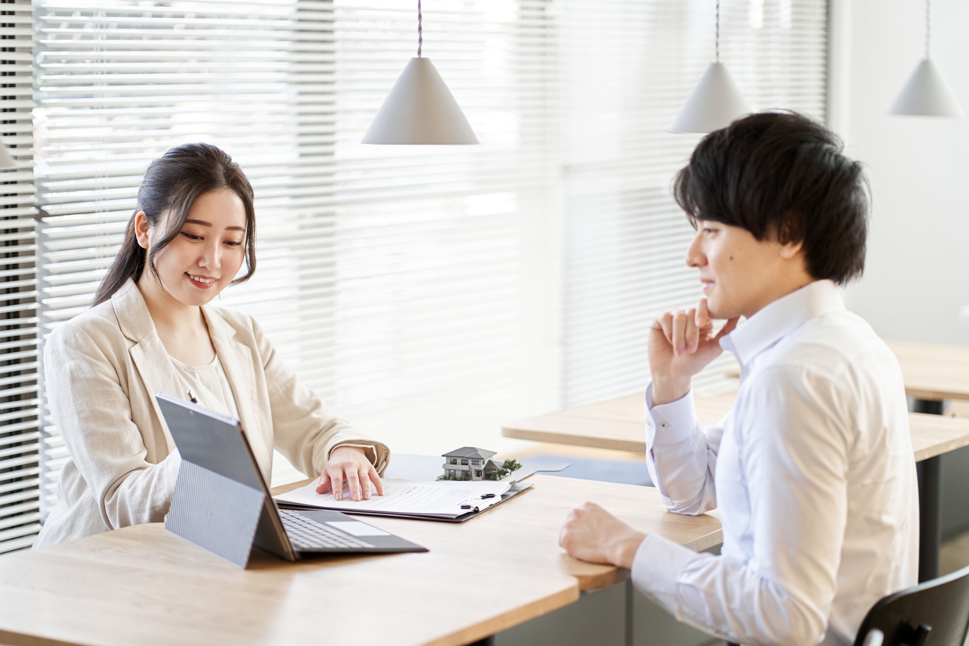 Asian business person having a real estate investment meeting in a coworking space