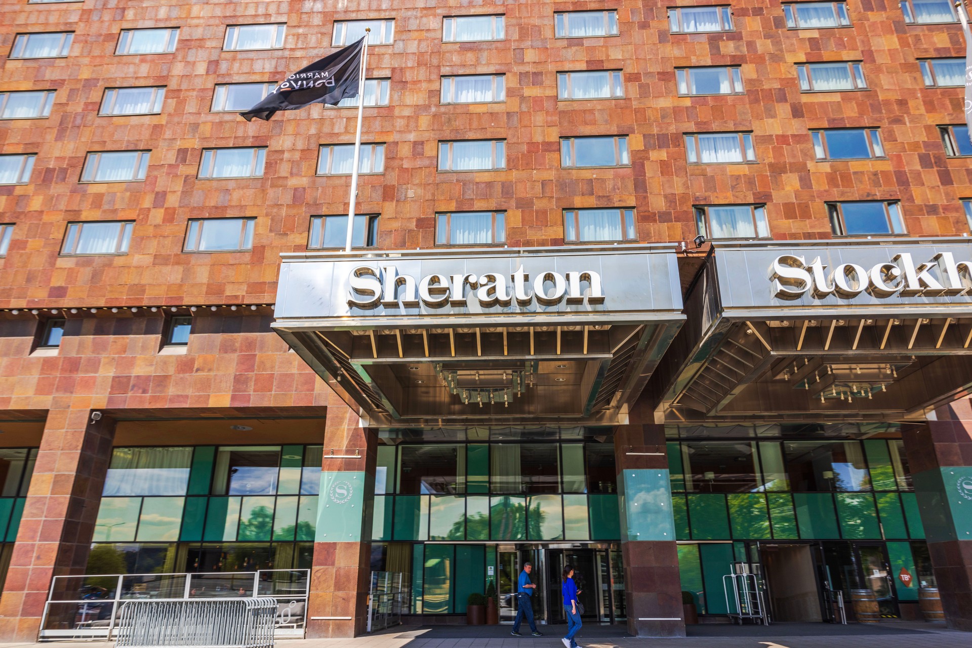 Close up view of facade of Sheraton hotel in Stockholm on sunny day.